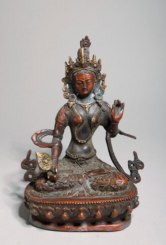 CHINESE BRONZE SEATED BUDDHA: Molded seated Buddha holding a mirror and with one hand raised. 8" H x 5.75" W.