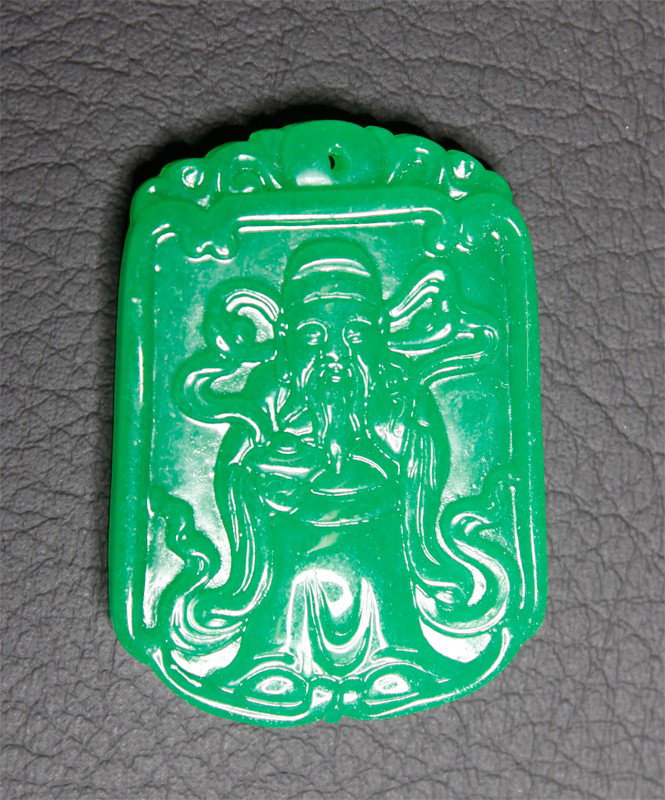 CHINESE CARVED JADE GUAN GONG PLAQUE: One side carved depicting Guan Gong. 2" L.