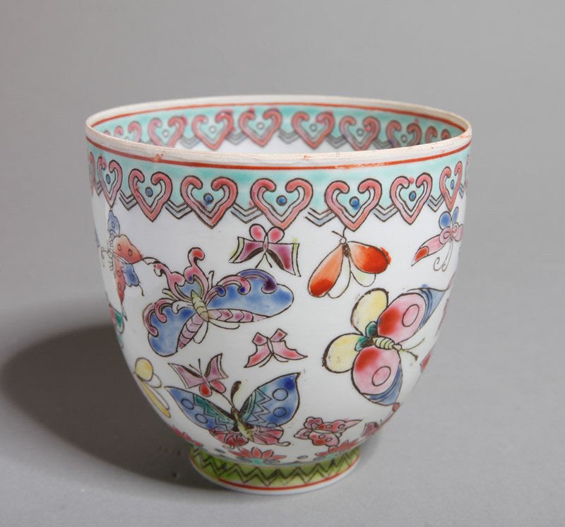 CHINESE EGGSHELL PORCELAIN CUP: Interior with duck in red, exterior enameled with colorful butterflies. Qianlong mark in iron red. 3" H x 3.125" DIA. Excellent condition.