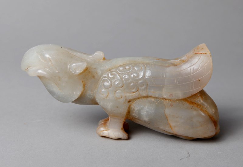 CHINESE CARVED JADE BIRD: Carved to depict a bird with realistic details, holding a worm in its' mouth. 2.125" H x 4.25" L. Excellent condition.