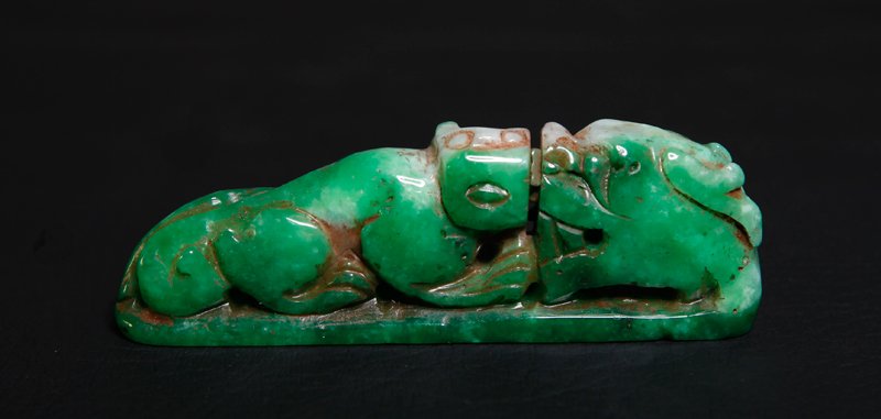 CHINESE CUI JADE FOO DOG: Carved on both sides depicting a foo dog and other beast face to face. 3.25" L.