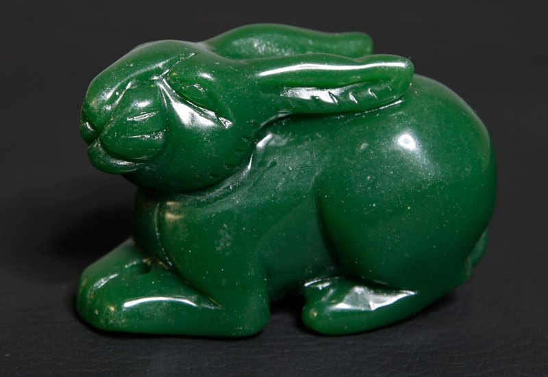 CHINESE CARVED JADE RABBIT: Seated rabbit with raised head. 2" H x 3.125" L.