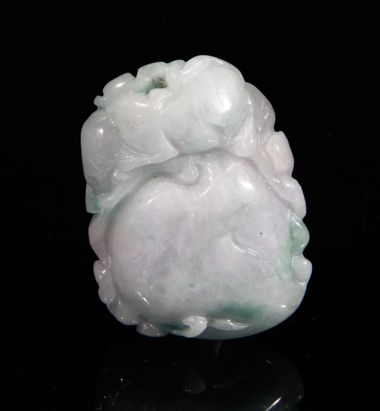 CHINESE CARVED JADEITE PENDANT: Carved to depict a peach with leaves and squirrel to one side, the reverse carved with ruyi and bat along the side. In white and green with hints of lavendar. 1.5" L. Excellent condition.
