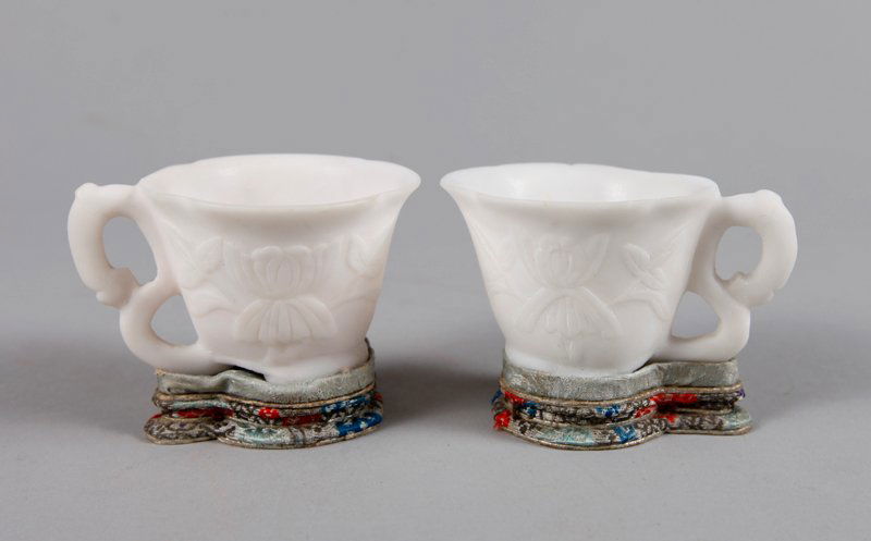 PAIR OF CHINESE ALABASTER TEA CUPS: With flower carvings, in box and with slik stands that match box. 1.625" H. Excellent condition, box lacking lid.