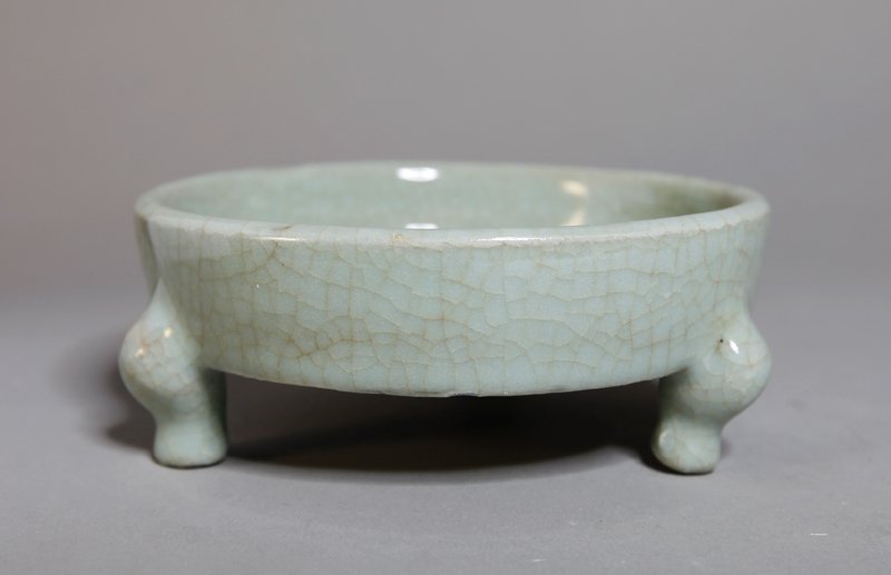 CHINESE PORCELAIN FOOTED BRUSH WASHER: In green geyou glaze, resting on three feet. Six character Qianlong mark in blue. 1.5" H x 4.625" DIA.
