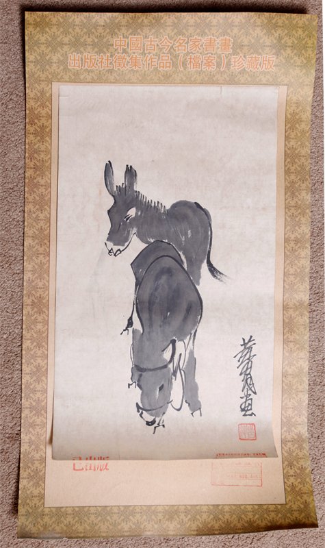 PUBLISHING HOUSE PAINTING BY HUANG ZHOU: Depicting two donkeys. Signature and seal mark with Publishing House Archive seal marks, and partially attached to silk brocade mat. 20" H x 12" W.