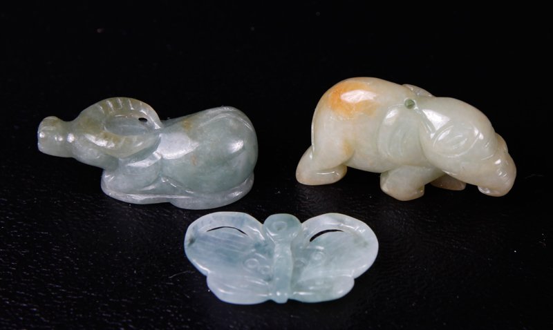 3 SMALL CHINESE JADE ANIMAL FIGURES: One depicting a butterfly, one depicting an elephant, and one depicting a water buffalo. Largest 1.375" L. All in excellent condition.