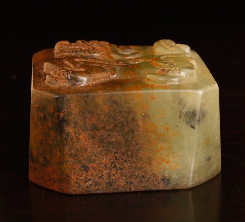 Chinese Carved Jade Seal: In light green with russet and black, the top carved with foo dog, the seal with four characters. 1.125" H x 1.875" Sq. Excellent condition.