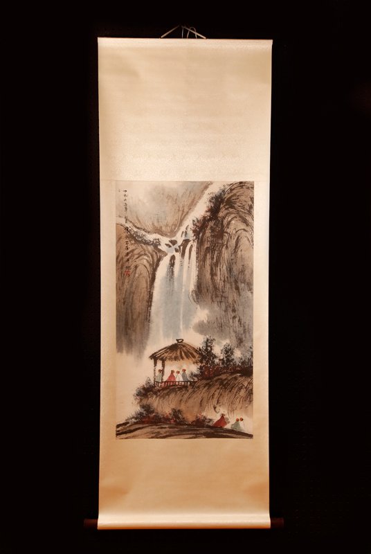 Chinese Scroll Painting Attb. to Fu Bao Shi: Attached to silk brocade, painted to depict a mountain waterfall with figures in a gazebo and figures on land. Signature and seal mark along left side. 35.25" H x 18.75" W, painting only. Excellent co