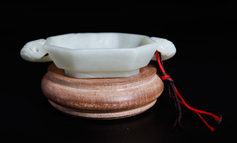 CHINESE CARVED JADE BRUSH WASHER & STAND: Two handled cup form brush washer, resting on carved wood circular stand. .5" H x 4" L (brush washer).