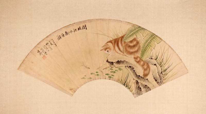 Chinese Mounted Signed Fan Face Painting: Mounted on silk blend heavy paper, painted to depict a cat viewing fish from a rock. Signature and seal mark in upper left. 7.5" H x 21.5" W, fan only. Excellent condition.