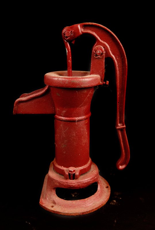 Antique Primitive Hand Well Pump: Painted red, 15.25" H x 9.5" W. Good condition with wear consistent with use.