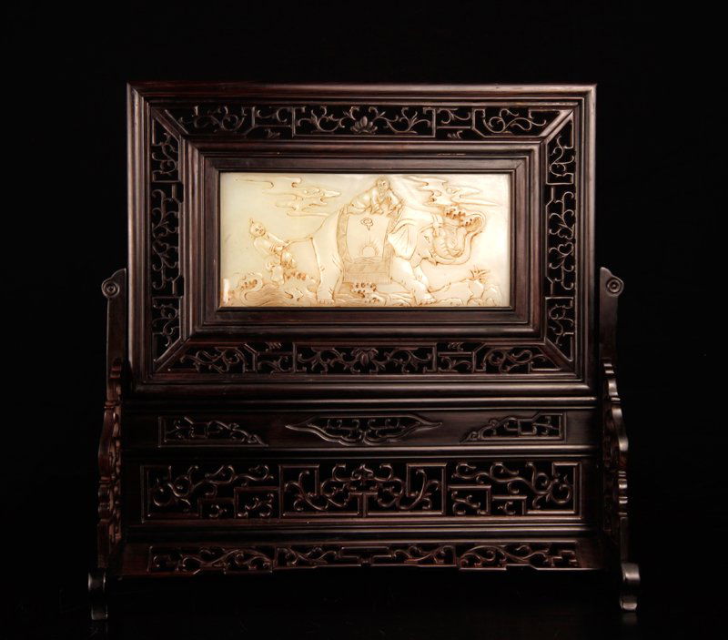 Chinese Jade & Zitan Wood Table Screen: In carved hardwood openwork frame, the jade carved on one side depicting boys riding and pulling the tail of an elephant. The reverse with lines of caligraphy. 12.375" H x 12.875" W x 4.75" D. Excelle