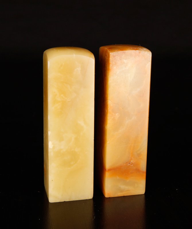 Pair of Chinese Soapstone Seals: Blank seals with slightly rounded tops in celadon and russet. 2.625" L. Excellent condition.