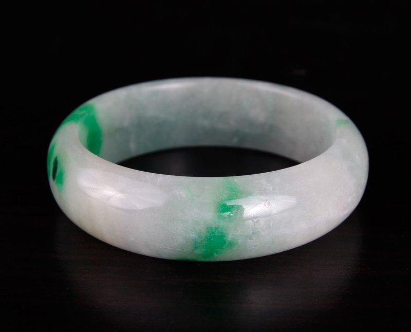 Chinese Hardstone Bangle: In light celadon and green apple. Inside diameter 2.25", outside diameter 3". Excellent condition.