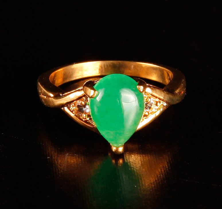 Chinese Carved Hardstone Teardrop Ring: Mounted in gold colored metal, with teardrop shape stone. Excellent condition.
