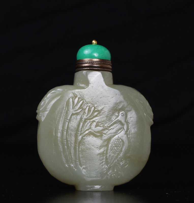 Chinese Carved Jade Snuff Bottle: One side carved depicting a figure in a mountain scene, the other side carved with bamboo. Green quartz metal mounted lid/snuff stick. 2.875" H x 2.25" W. Excellent condition.