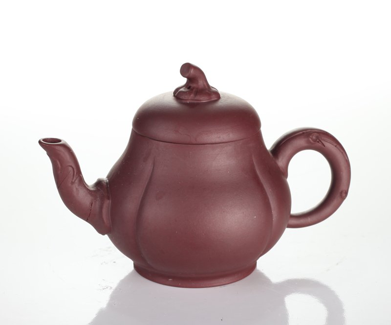 Chinese Zisha Clay Teapot: In gourd form with vine spout and handle, stem on top of lid. Four character mark on underside. 3.625" H x 5.25" L x 3" W. Excellent condition.