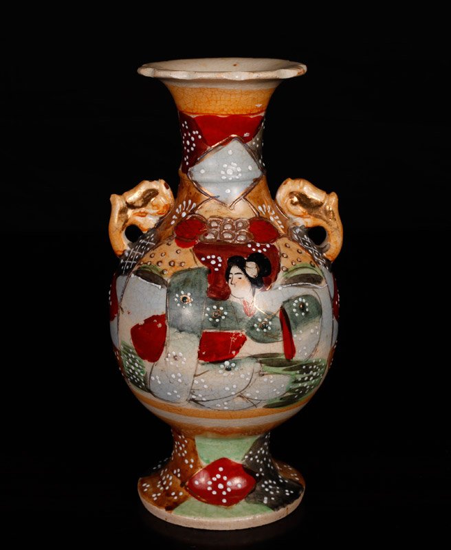 Japanese Meiji Period Satsuma Vase: Earthenware two handled footed vase decorated with belle to one side, and floral to other side. Highlighted in gilt and moriage. 7.125" H x 3.625" W. Excellent condition.