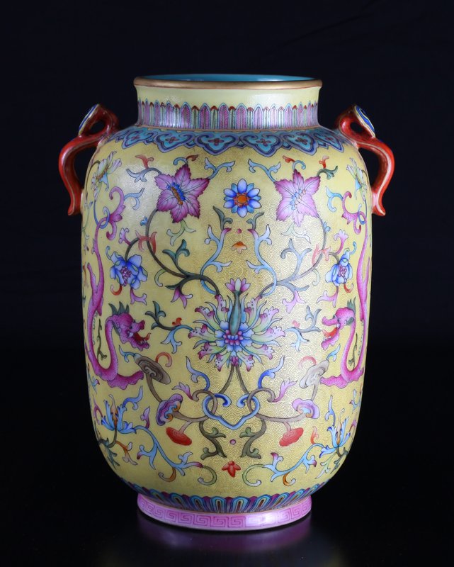 Chinese Famille Rose Porcelain Vase: In yellow graviata enamel with dragons, flowers and vines. Four character mark in blue on underside. 9.5" H x 7" W. Excellent condition.