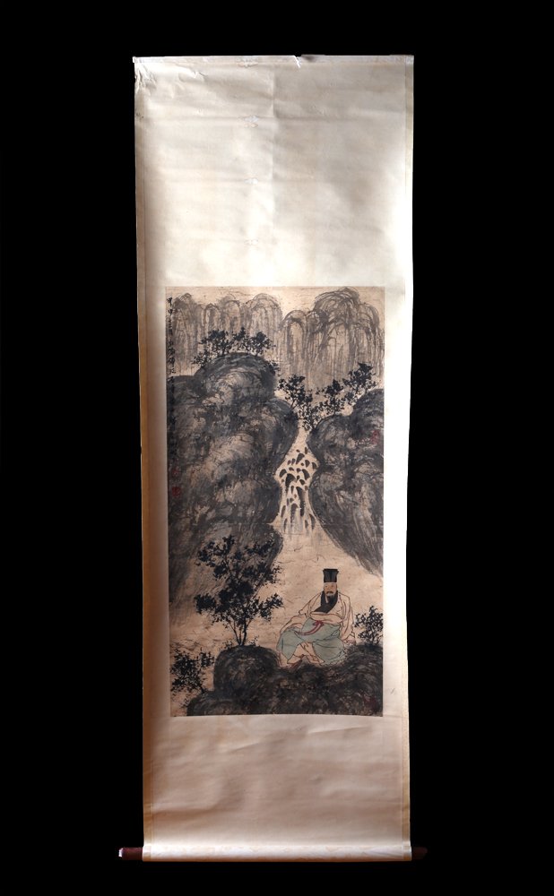 Chinese Watercolor Scroll Painting: Attached to paper, depicting a seated figure beneath a waterfall. Caligraphy and two seal marks in red in upper left. Additional seal mark in red in middle right. Painting measures 38.5" H x 19" W. Ve
