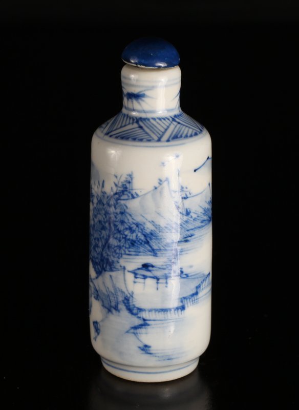 Chinese Blue & White Porcelain Snuff Bottle: Depicting a mountain village scene with grasshoppers at neck. Four character mark in blue on underside. 4" H x 1.5" W. Excellent condition.