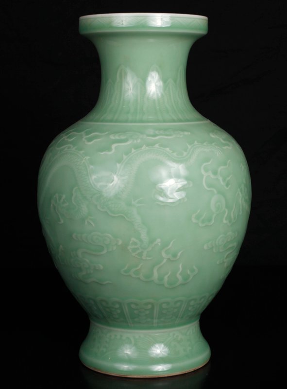 Chinese Porcelain Vase: In a celadon green glaze, incised with dragons and ruyi. Six character mark in blue on underside. 12.625" H x 7.375" W. Excellent condition.