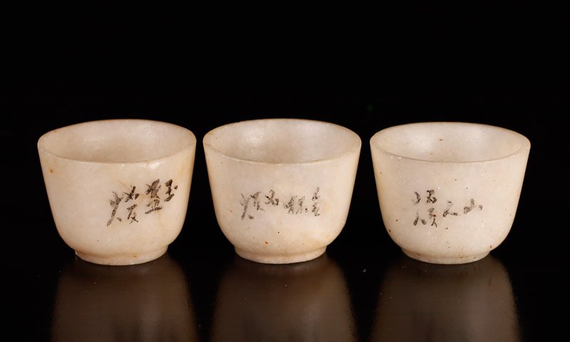 3 Japanese Soapstone Miniature Cups: Each carved in white soapstone, with character marks in black to each. 1.125" H x 1.5" W. Excellent condition.