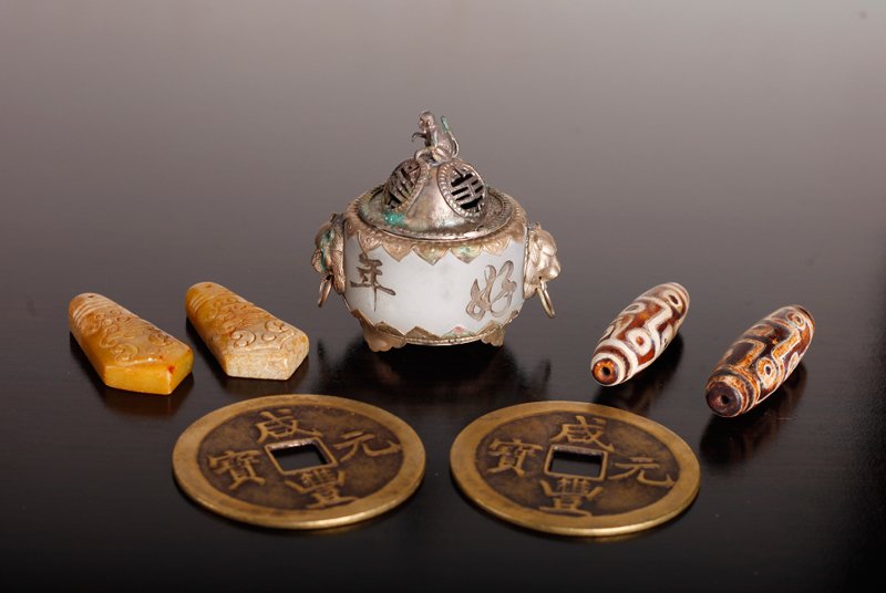 7 Piece Asian Grouping: Includes a small censer, two archaric style soapstone beads, two wooden beads and two large brass coins. All in very good to excellent condition.