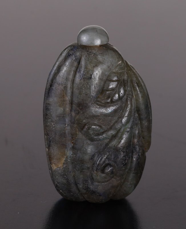 Chinese Carved Labradorite Snuff Bottle: Carved to depict a squash with protruding leaves and vines. 2.375" H x 1.375" W. Excellent condition.