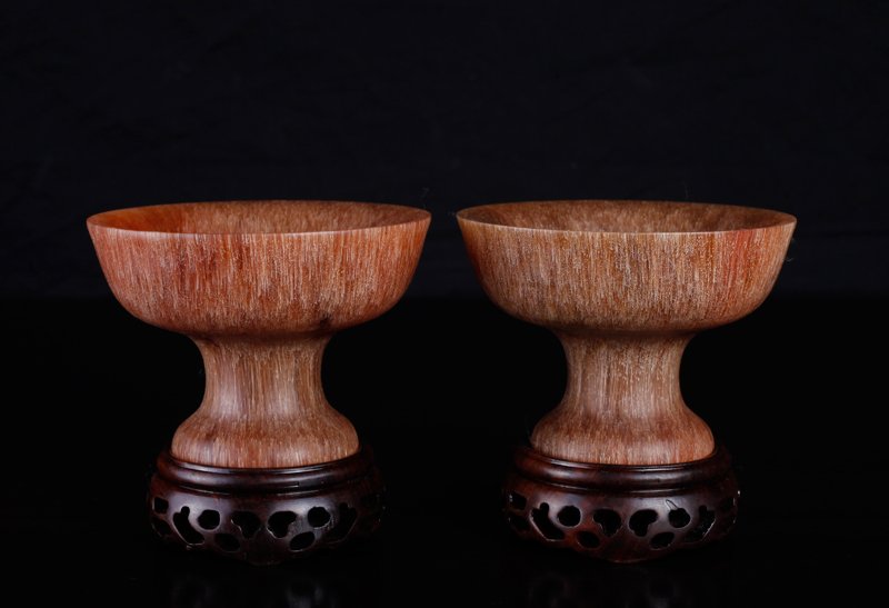 Pair of Chinese Horn Style Cups on Stands: Each footed cup on carved wood stand. Cup measures 2.625" H x 3.75" Dia. Excellent condition.