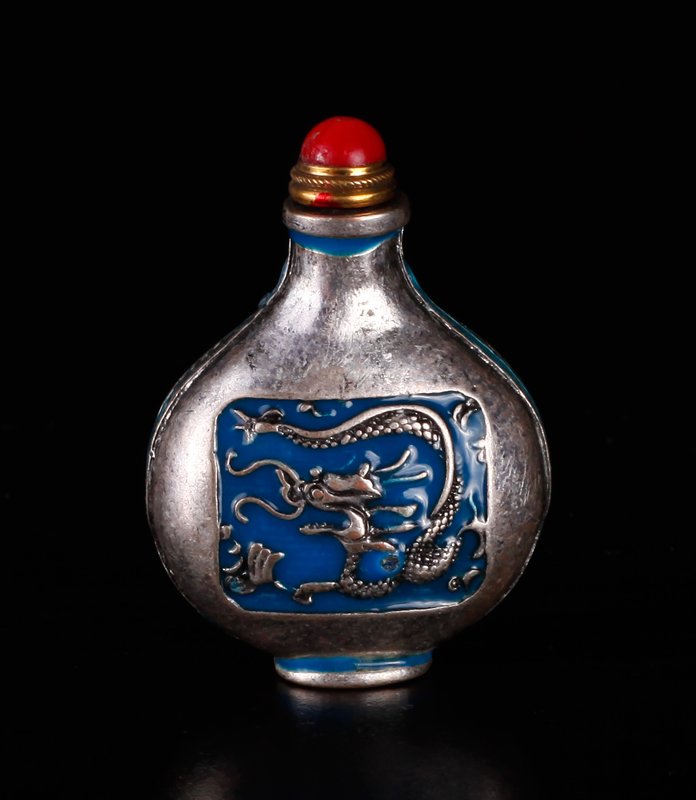 Chinese Silver Snuff Bottle: One side decorated with Phoenix in red enamel, the other side with dragon in blue enamel. Three character mark on underside. 1.75" H x 1.375" W. Excellent condition.