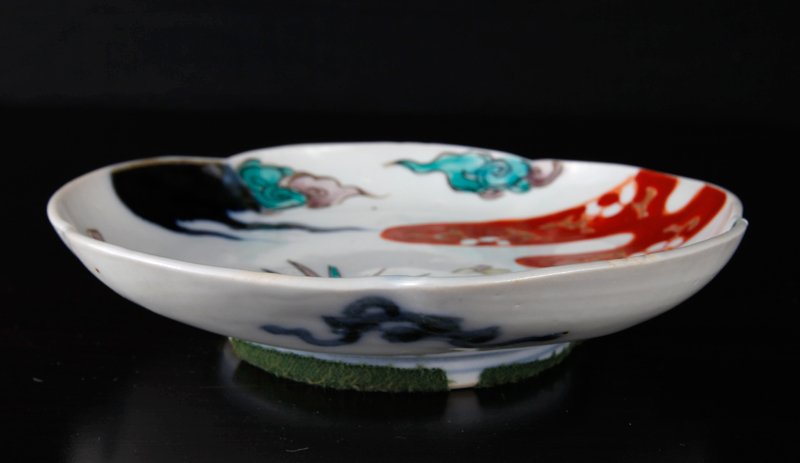 Antique Japanese 5 Color Imari Plate 6.375"": Deocrated in red, cobalt, purple, yellow and green highlighted in gilt. The sides with ribbon designs in blue. Plate measures 6.375" L x 6.125" W. Very good condition, there is a firing crack to side.