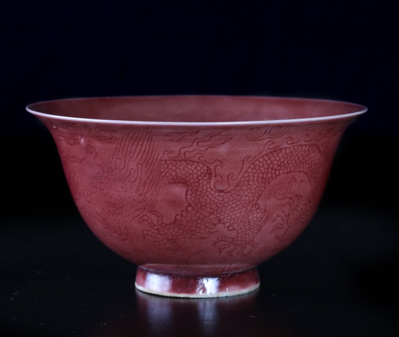 Chinese Incised Porcelain Bowl: The exterior incised with dragons and flaming pearl, in a light brown gravy colored glaze. Six character mark within two concentric circles in blue on underside. 2.5" H x 4.75" Dia. Excellent conditio