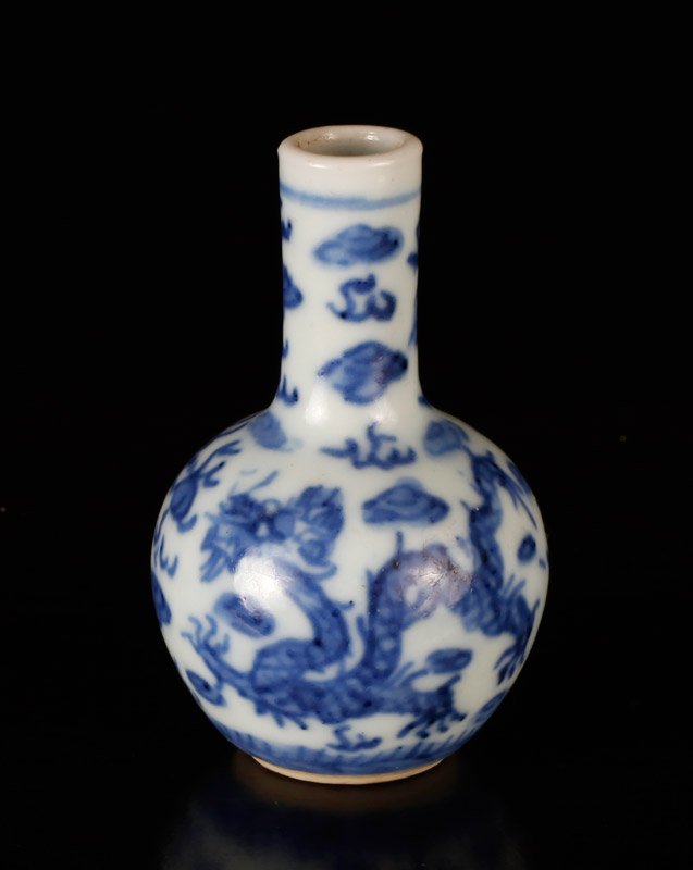 Chinese Republic Blue & White Miniature Vase: Decorated with five claw dragon amid ruyi. Marked CHINA in blue on underside. 2.375" H x 1.375" W. Excellent condition. From the estate of Carl F. Butts: Professor Emeritus at Wayne State University a