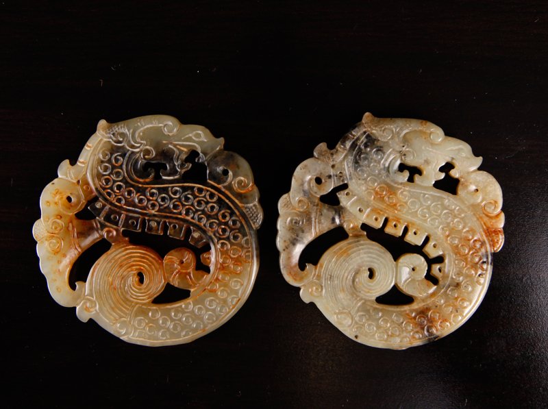 Pair of Chinese Carved Jade Plaques: Both carved on both sides depicting archaic designs. 2.625" Dia. Excellent condition.
