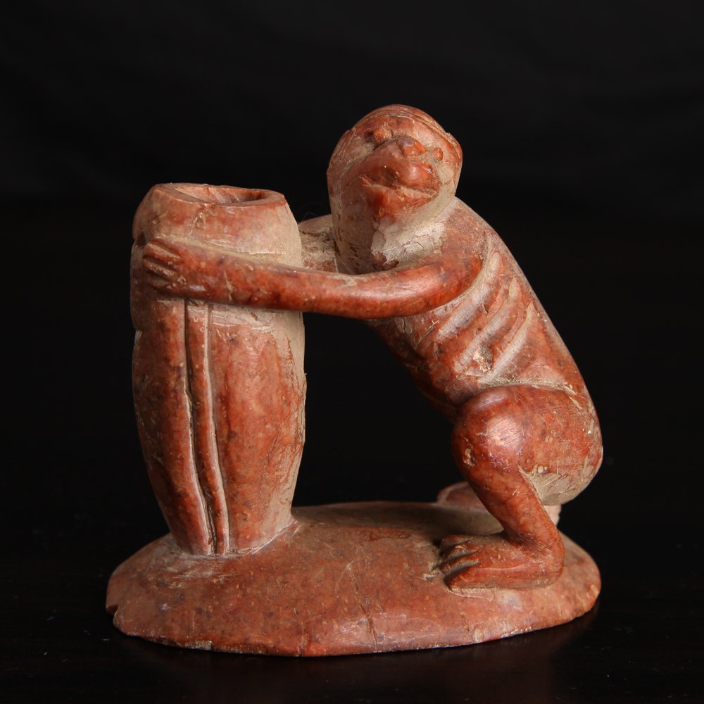 Chinese Republic Soapstone Monkey Carving: Carved monkey with vase/holder.Â Marked Made in China on underside.Â Some small chips around bottom edge.Â 2.875" H x 3" L x 1.875" W.