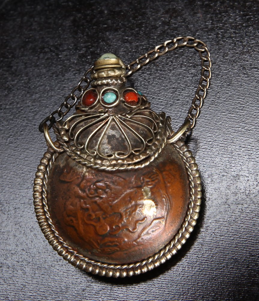 Tibetan Metal & Gemstone Snuff Bottle: With chain and turquoise, carnelian and jade. 1.625" H. Very good condition.