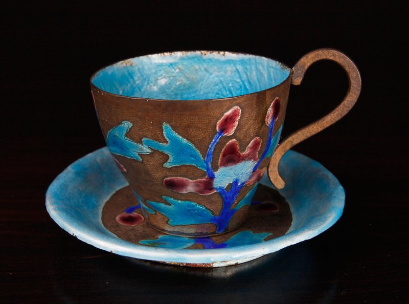 Chinese Republic Enamel/Copper Tea Cup & Saucer: Both enameled with floral designs in purple and blues. Both stamped CHINA on underside. Tea cup measures 1.875" H x 3" L (with handle), saucer measures 3.625" Dia. Very good condition with slight wear