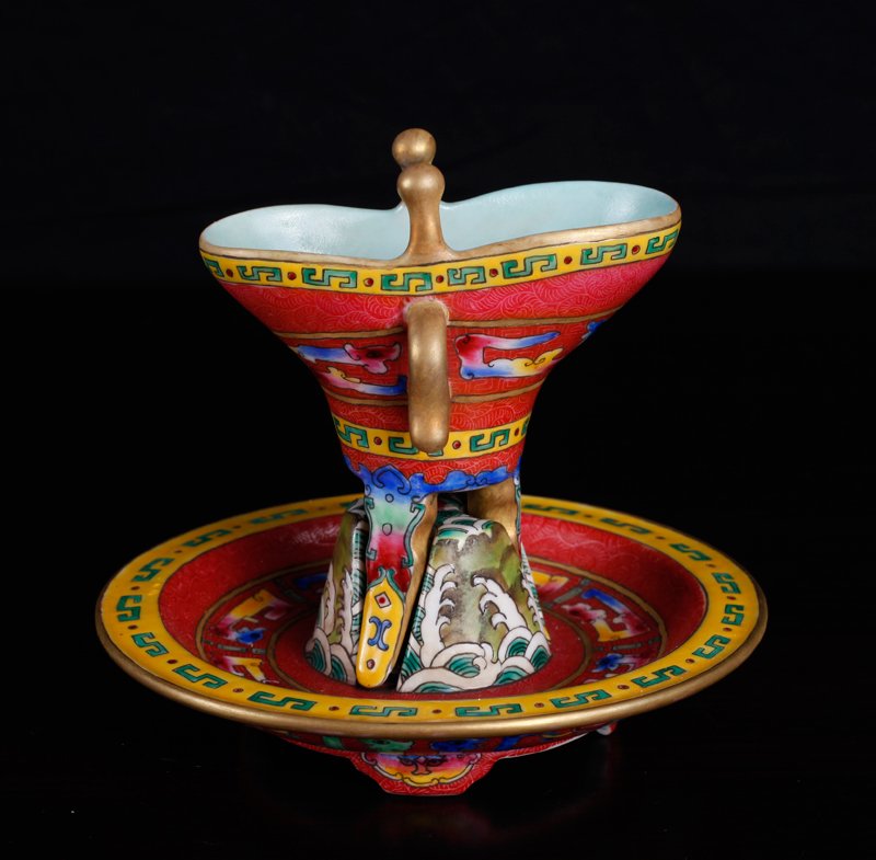 Chinese Famille Rose Wine Cup with Base: In pink graviata, with turquoise interior, Greek key, wave and floral designs and highlighted in gilt. Cup and underplate with four character mark in blue. Entire cup and plate measures 4.75" H x 5.25