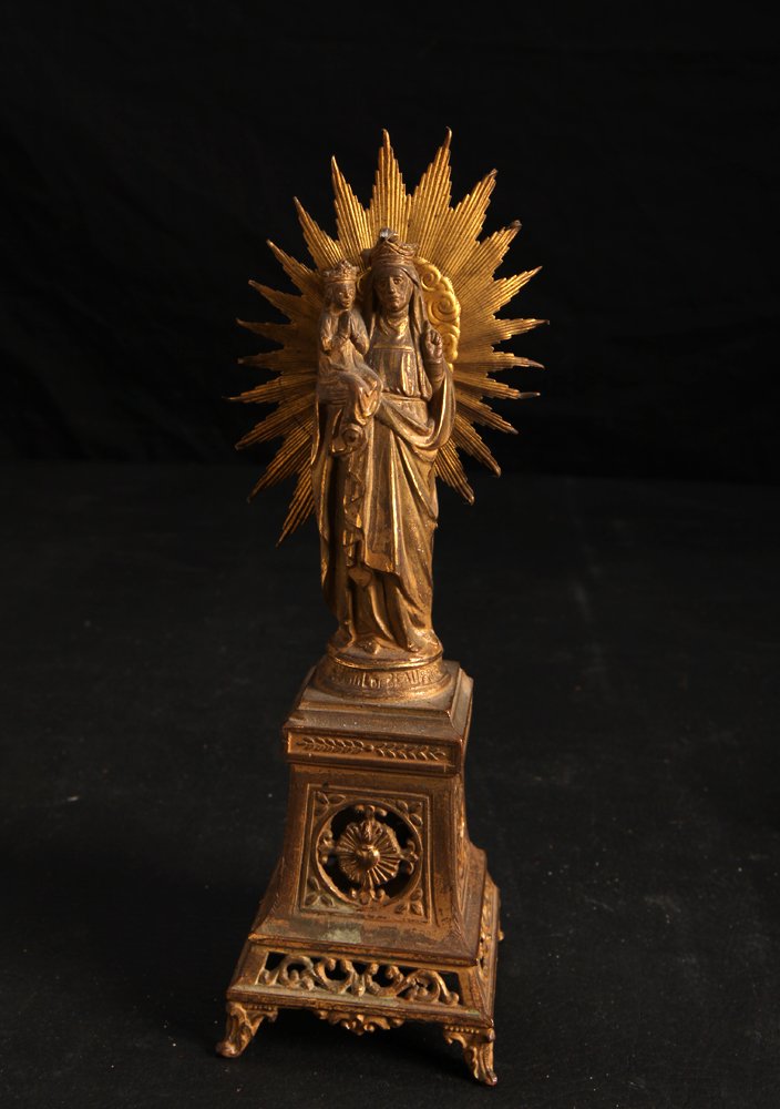 Antique French Brass Mother Mary Statue: Depicting Mother Mary and Jesus upon openwork base with sunburst behind. Marks to front illegible, back marked France and DSA. 8.25" H x 2.5" W. Bends at starburst tips, tip of Mary's hat with dent.