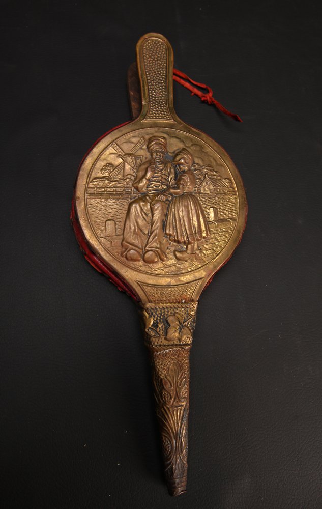 19th C. Dutch Brass & Leather Bellows: With figure of man and girl child. 17" L x 6.75" W. Tip with slight dent, hanging leather strap with wear.