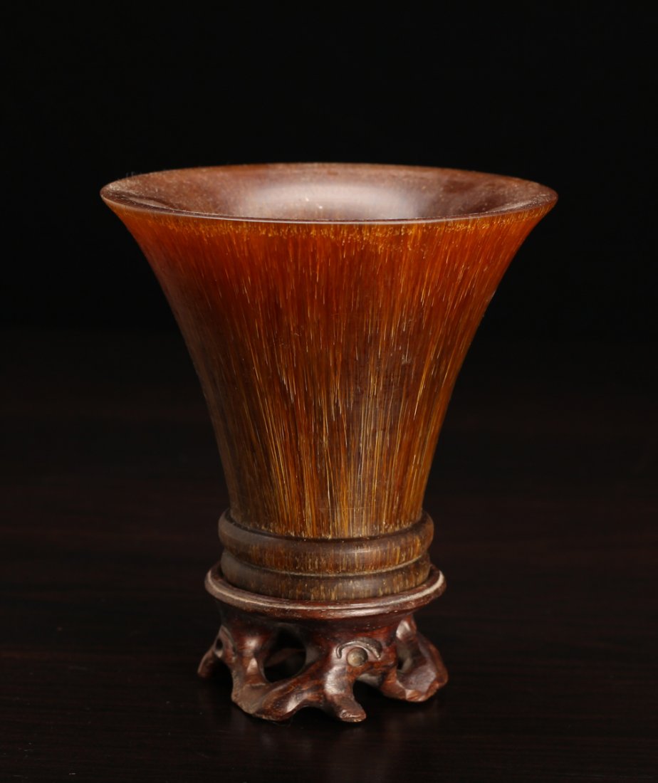Chinese Horn Style Cup with Stand: Composition molded, with flared mouth. Rests on openwork carved wood stand. Cup measures 3.625" H x 4" Dia. Excellent condition.