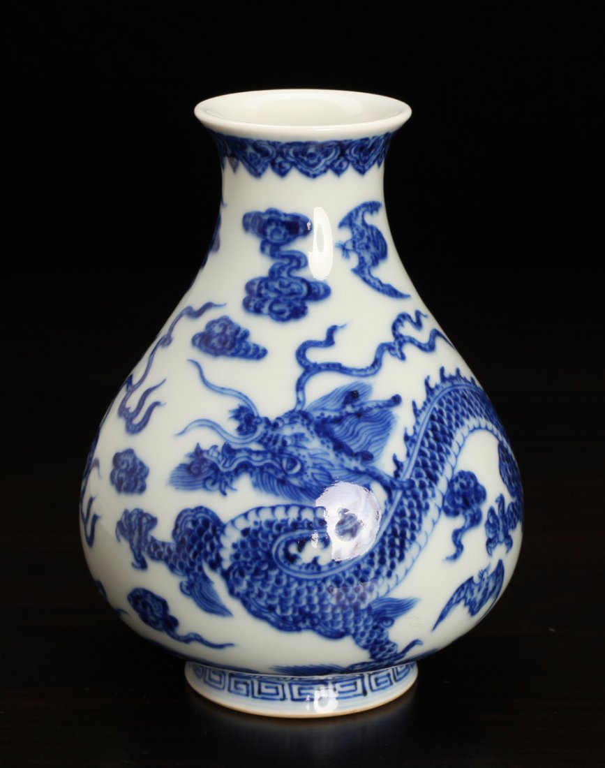 Chinese Blue & White Porcelain Vase: Small vase, the body decorated with dragon, flaming pearl, bats and ruyi. Six character mark in blue on underside. 5" H x 3.75" W. Excellent condition.