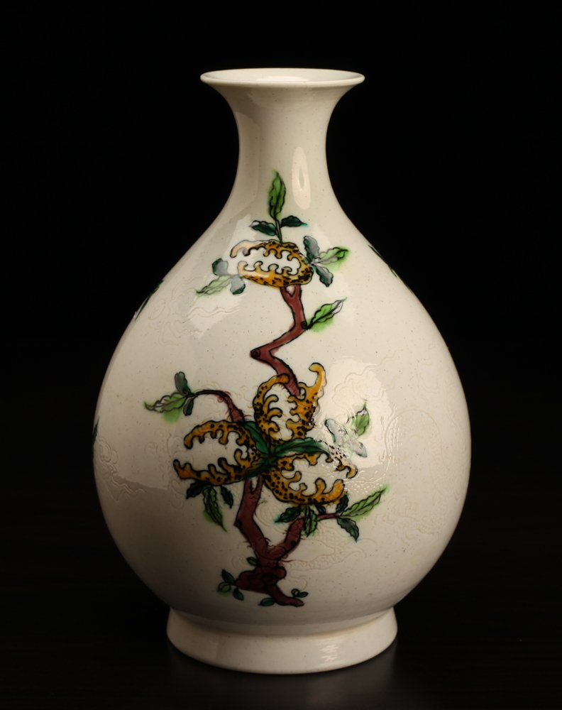 Chinese Incised Porcelain Vase: White ground, incised with dragons and flaming pearl, the remainder of the body with three various fruit trees in multi-color. Six character mark in blue on underside. 6.5" H x 4.25" W. Excellent cond