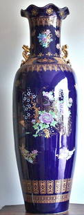 Lg. Oriental blue porcelain vase: Lg. Oriental blue porcelain vase with gold accents measuring approx. 42h x 15w x 15d in very good condition..