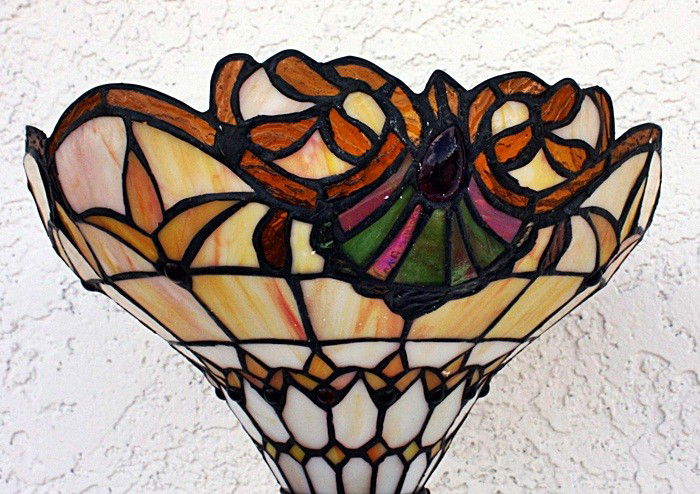 Stained Glass Ornate floor lamp: Ornate stained glass lamp containing quality hand cut glass on a swrill pattern base measuring approx. 68hx12x12. Mint condition.