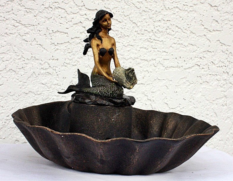 Mermaid Table Fountain: Mermaid Table fountain containing a brown finish and a multi-color finish mermaid w/shell measuring approx. 10x12x12 in very good condition.