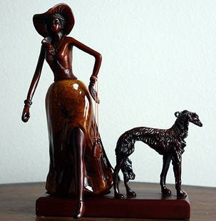 "Aristocrat Lady with Dog" sculpture: "Aristocrat Lady with Dog" sculpture measuring approx. 10.5 x 8 x 6 made of fine wood carving. The sculpture is in very good condition.