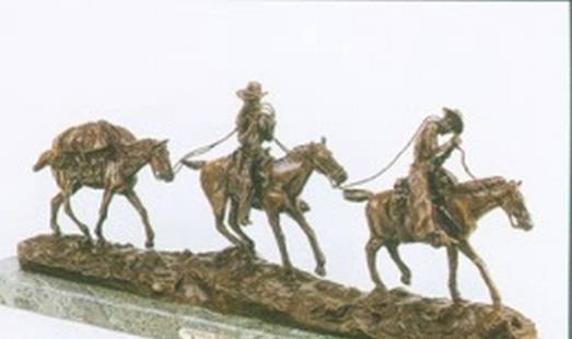Russell "Changinng Outfits" bronze sculpture: "Changing outfits"" after Russell, signed,high quality measuring approx. 14x39 having a very good paina and finish being well maintained in very good condition.